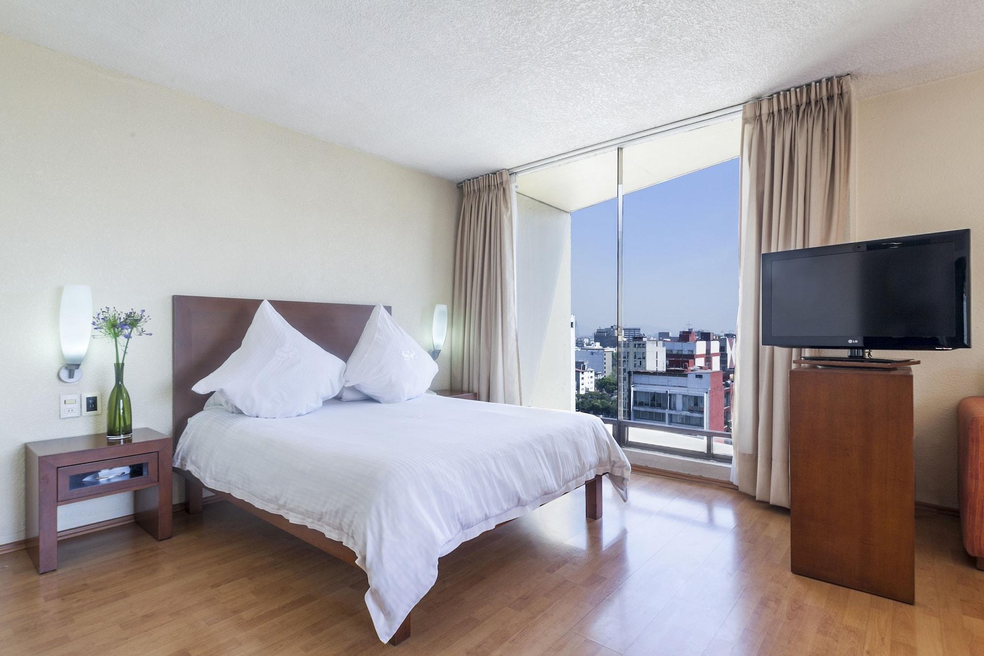 الشقق الفندقية مدينة مكسيكوفي  إكس سويتس سان مارينو المظهر الخارجي الصورة A bedroom at the hotel