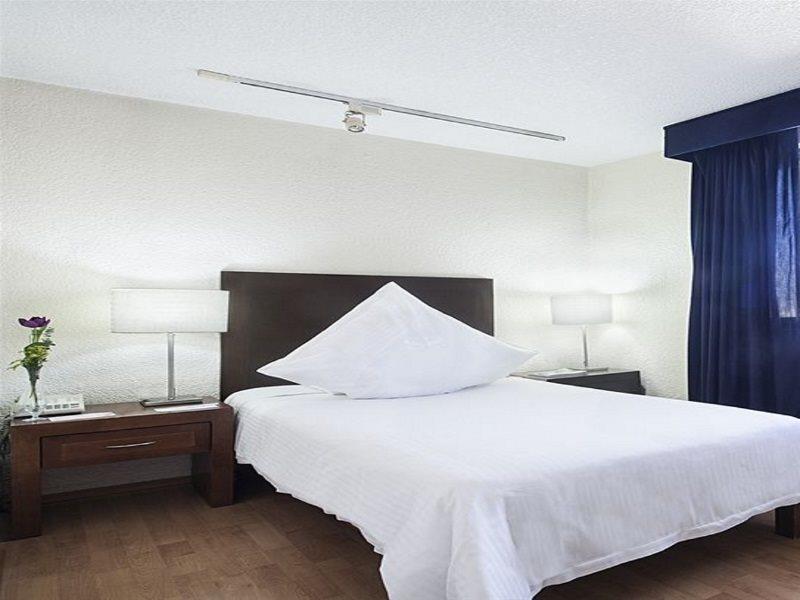 الشقق الفندقية مدينة مكسيكوفي  إكس سويتس سان مارينو المظهر الخارجي الصورة A bedroom at the hotel